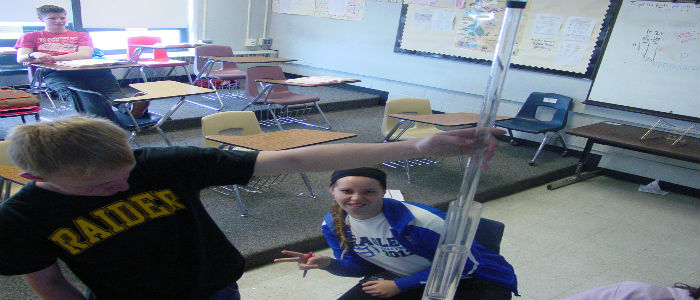Curtis Wolf and Ashley Wysocki observe the volume of water the is pushed into the inner tube.